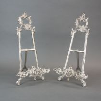 A pair of silvered brass easels, H. 40cm.