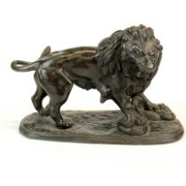 A 19th century spelter figure of a lion and a snake, L. 21cm H.14cm.
