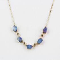 A 10ct (stamped 10k)yellow gold necklace set with doublet opals and aquamarine.