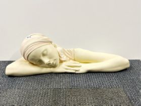 An American "chalk" ceramic figure signed on the reverse, L. 70cm.