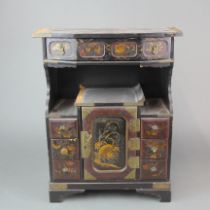 A miniature 19th C. Japanese lacquered cabinet, H 41cm, W 43cm. D 14cm.