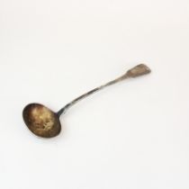 A Georgian hallmarked silver soup ladle, L. 34cm.