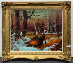 A gilt framed oil on canvas of pheasants in a winter landscape with indistinct signature, frame size