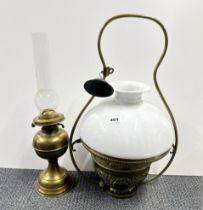 A brass hanging oil lamp and shade H. 59cm. together with a free standing oil lamp and chimney.
