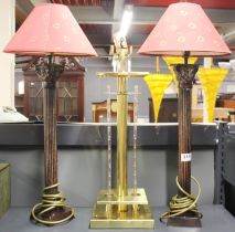 A pair of bronzed metal classic colum table lamps, H. 63cm. Together with a gilt brass table lamp.