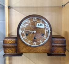 An Art Deco oak mantle clock with chiming movement, W. 33cm.