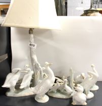 A Lladro porcelain table lamp with a group of six Nao porcelain geese.