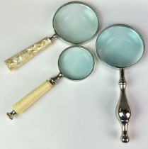 Three useful magnifing glasses, largest 24cm.