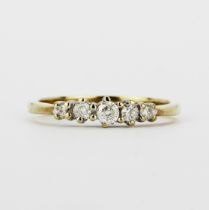 A hallmarked 9ct yellow gold ring set with graduated brilliant cut diamonds, (N).