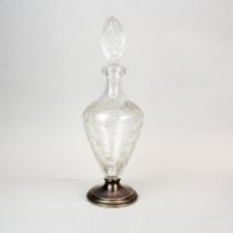 A etched glass decanter with sterling silver foot and non matching cut crystal stopper, H. 37cm.