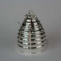 A silver plated honey pot, H. 12cm.