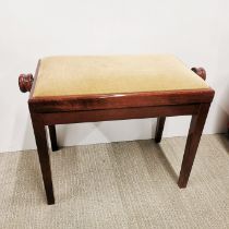 An adjustable mahogany veneered piano stool, 64 x 32 x 47cm.