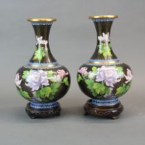 A pair of mid 20th century Chinese cloisonne on brass vases with wooden stands, H. 29cm.