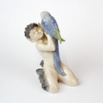 A Royal Copenhagen porcelain figure of a fawn with a parrot, H. 18cm.