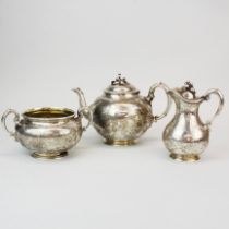 A heavy Victorian hallmarked silver Garrard's three piece tea set, H. 17cm, Spout to handle 24cm.