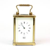 A small English brass carriage clock by Dent of London, H. 10.5cm.