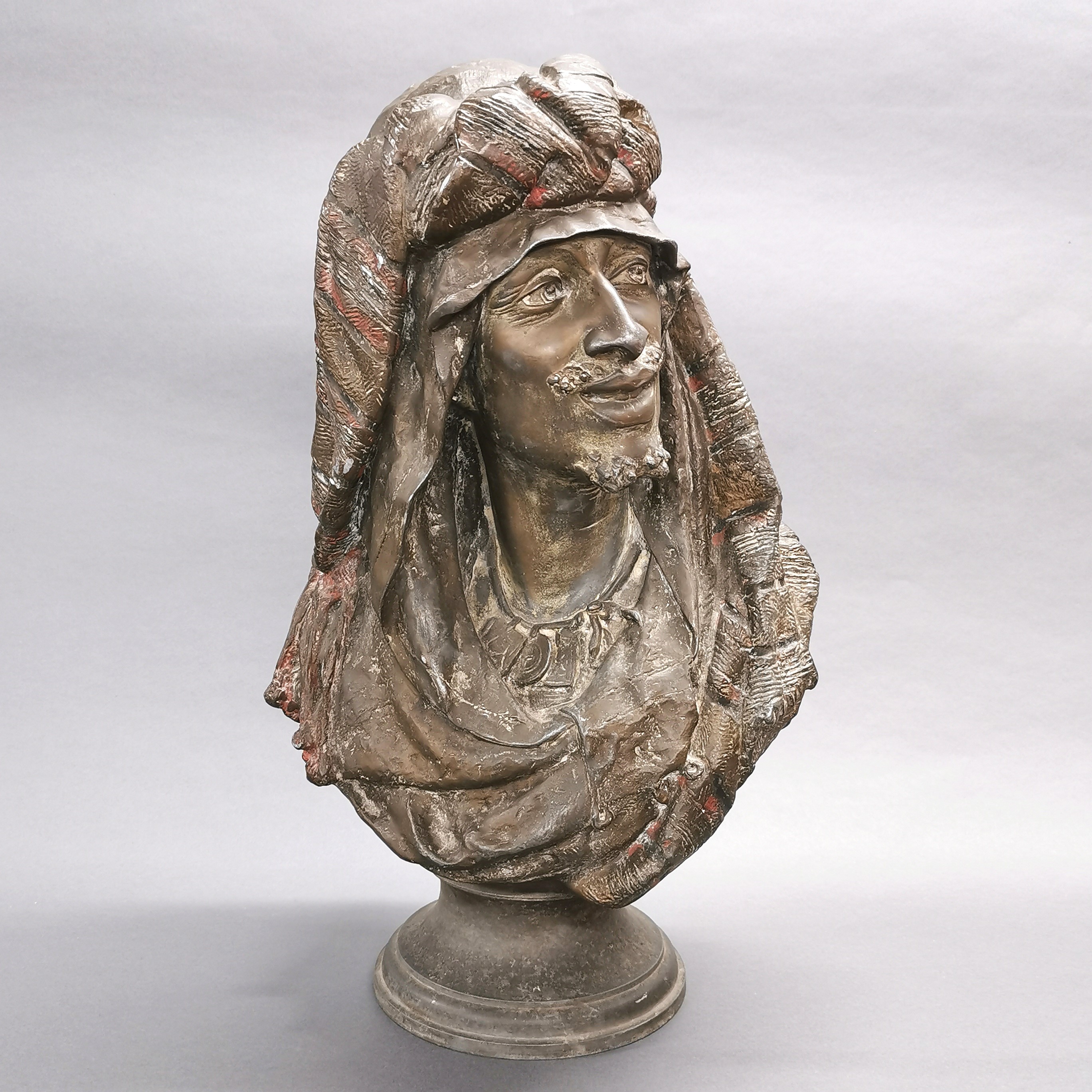 A large cast spelter bust of an Arab, H. 54cm.