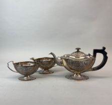 An Indian three piece silver tea set stamped sterling silver. Spout to handle 30cms.