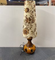 A 1970's German ceramic floor lamp with original shade, H. 130cm.