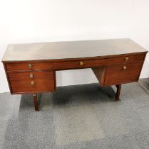 A teak G Plan E Gomme five drawer dressing table with plate glass top and original detatched