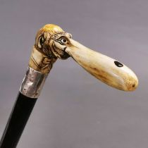 Late 19th/ early 20th century walking stick cane. Carved antler handle in the form of a gentlemans