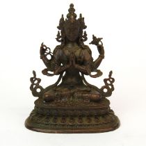 A small very detailed Tibetan bronze figure of a seated Tara. H. 10 cms