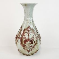 A Chinese hexagonal porcelain vase with under-glaze iron red decoration, H. 24cm.