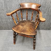 An oak tub hall chair with turned oak back supports, H. 82cm.