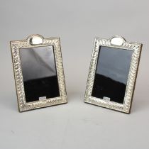 A pair of H.M. Silver photo frames, 13.5 x 19 cms