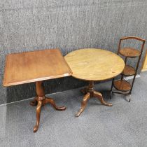 Two oak tripod tilt top occasional tables together with a folding oak cake stand, largest 76 x 60