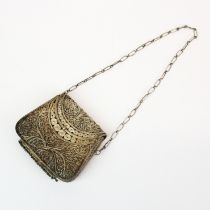 An Indian white metal filigree purse ( tested silver ) 9.5 x 8 cms.