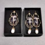 A pair of Alexander McQueen style costume jewellery earrings, and matching brooch. In the form of