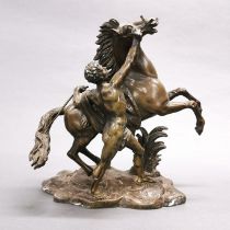 A cast bronze figure of a man and horse, H. 30cm.