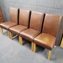 A set of four faux leather dining chairs, H. 103cm.