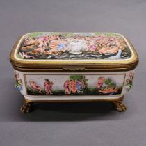 An Italian porcelain and gilt brass casket, with figural relief decoration, 21 x 13 x 10cm.