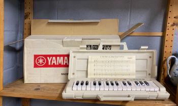 A boxed vintage Yamaha PS-1 keyboard.