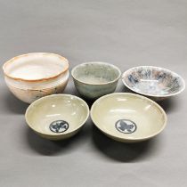A collection of five studio pottery bowls.