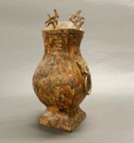 A Chinese archaic form lidded censer, H. 28cm.