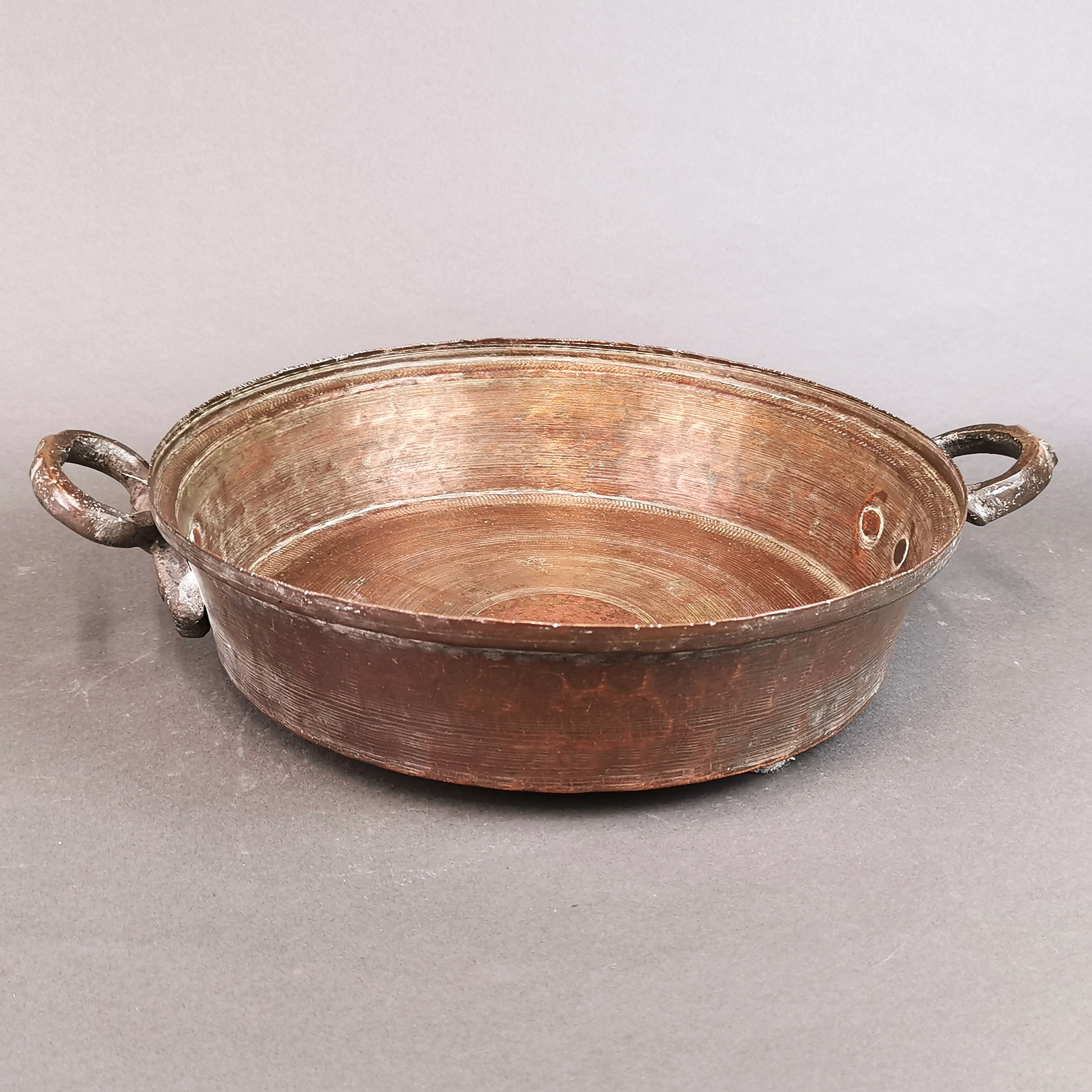 An Eastern hammered copper two handled pan, W. 38cm, together with a 19th century brass jug with - Image 3 of 3