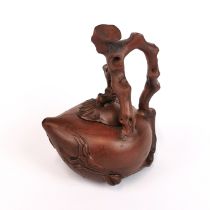 A Chinese naturalistic peach shaped Yixing terracotta teapot, H. 17cm.