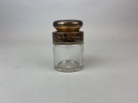 A hallmarked silver mounted cut crystal jar and lid. H.10cms. Engraved greeting for 1945