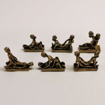 A set of six miniature brass erotic models, each displaying different positions of the Kama Sutra.