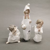 A group of three Lladro figures of children, two angels. Tallest figure missing staff, H. 22cm.