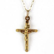 A 9ct yellow gold chain with a 9ct crucifix pendant, chain L. 48cm.