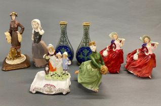 A group of Royal Doulton and others figures, with a pair of stoneware vases (one A/F to rim).