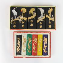 Two boxes of Chinese decorated ink blocks, larger box 18 x 10cm.