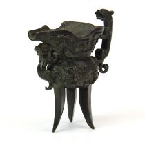 An archaic form bronze wine cup. H. 13.5 cms
