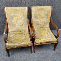 A pair of Edwardian mahogany armchairs with original embroidered backs and cushions, H. 90cm W.