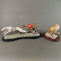 A mounted resin model of two greyhounds, L. 49cm.