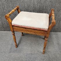 An oak and upholstered piano stool with liftable lid for storage, 60 x 60 x 40cm.